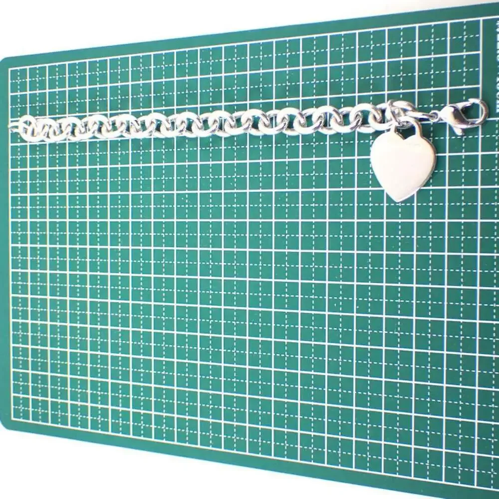 TIFFANY Silver Heart Charm Bracelet